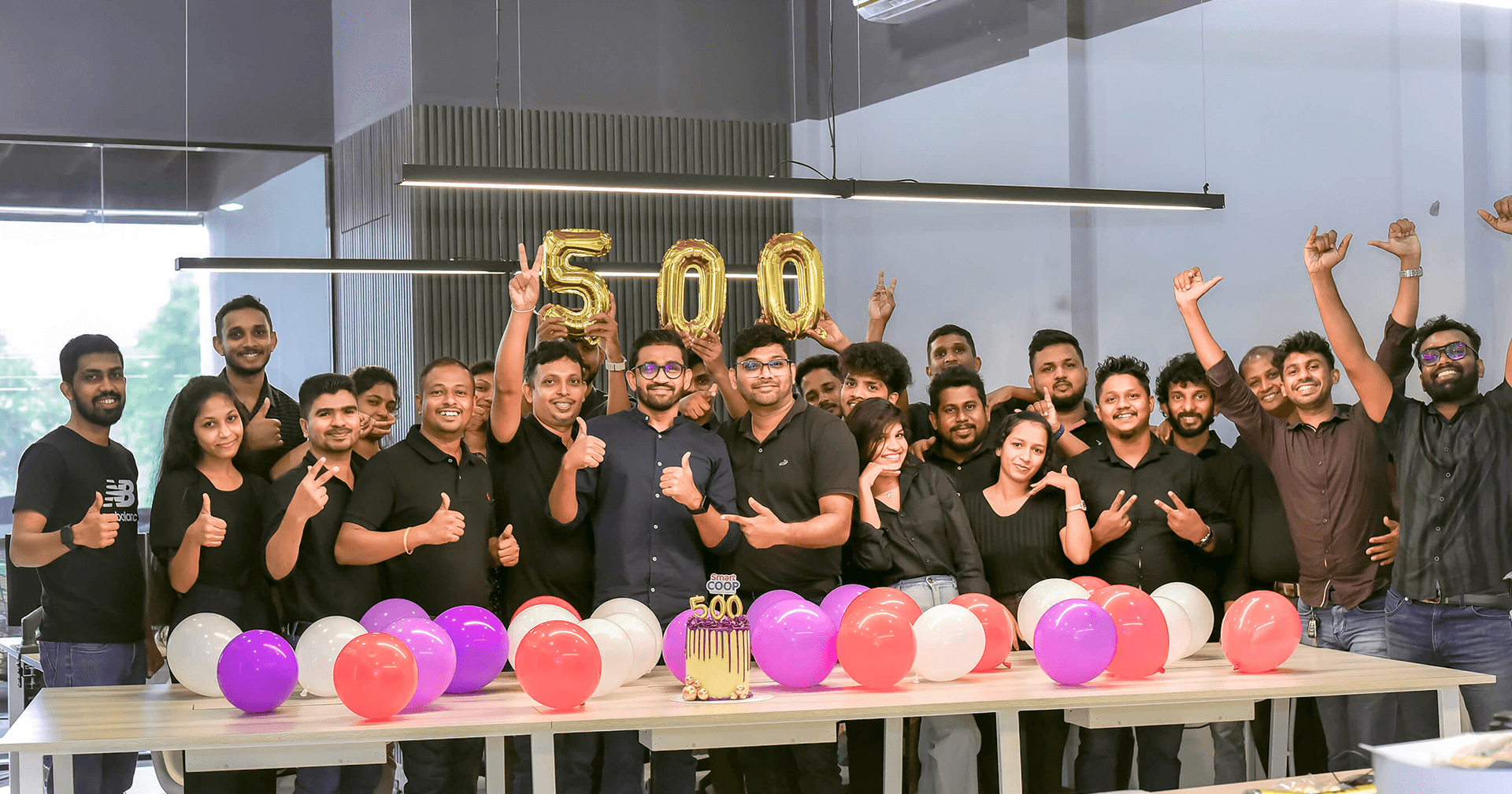 Nanosoft Global team celebrating 500 cooperatives milestone
